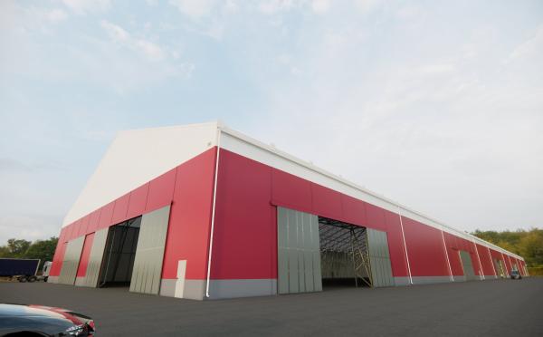Bâtiment industriel pour stockage vrac en environnement portuaire avec structure métallo textile